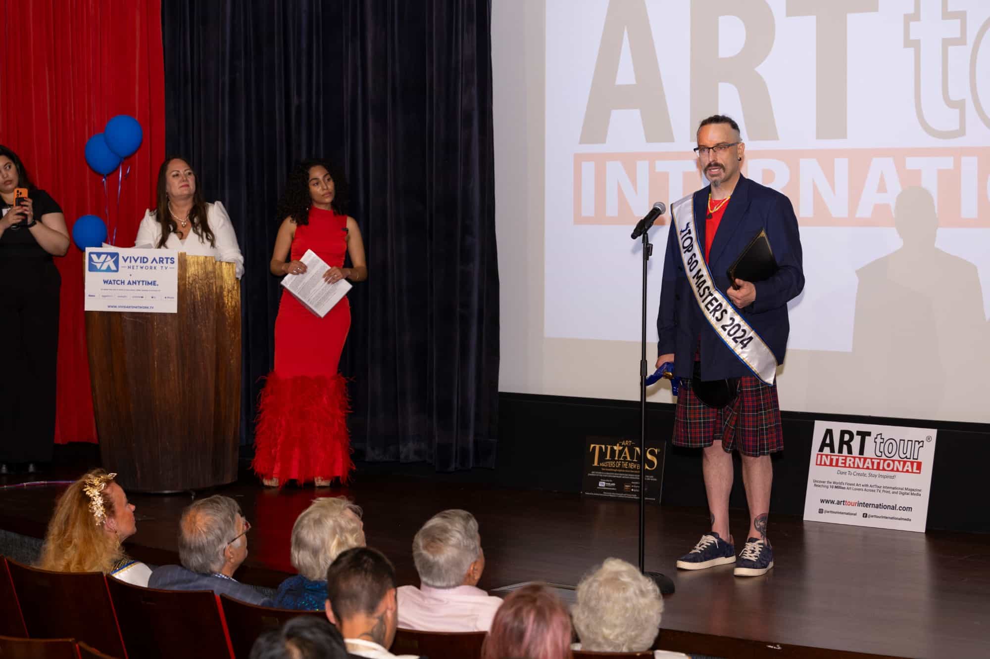 A 2024 honoree speaks on stage at the ceremony